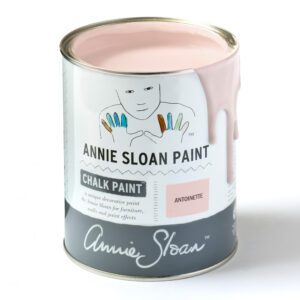 A can of Annie Sloan pale pink chalk paint with some paint dripping down.
