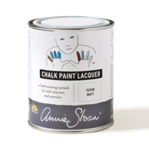 A can of Annie Sloan Chalk Paint Lacquer with colorful handprints on the label.