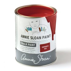 A can of Annie Sloan Chalk Paint in Emperor's Silk red.