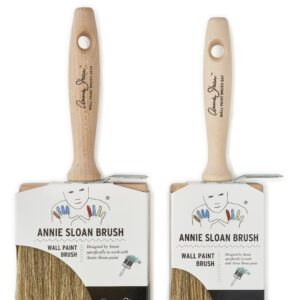 Two Annie Sloan paintbrushes with wooden handles on white background.